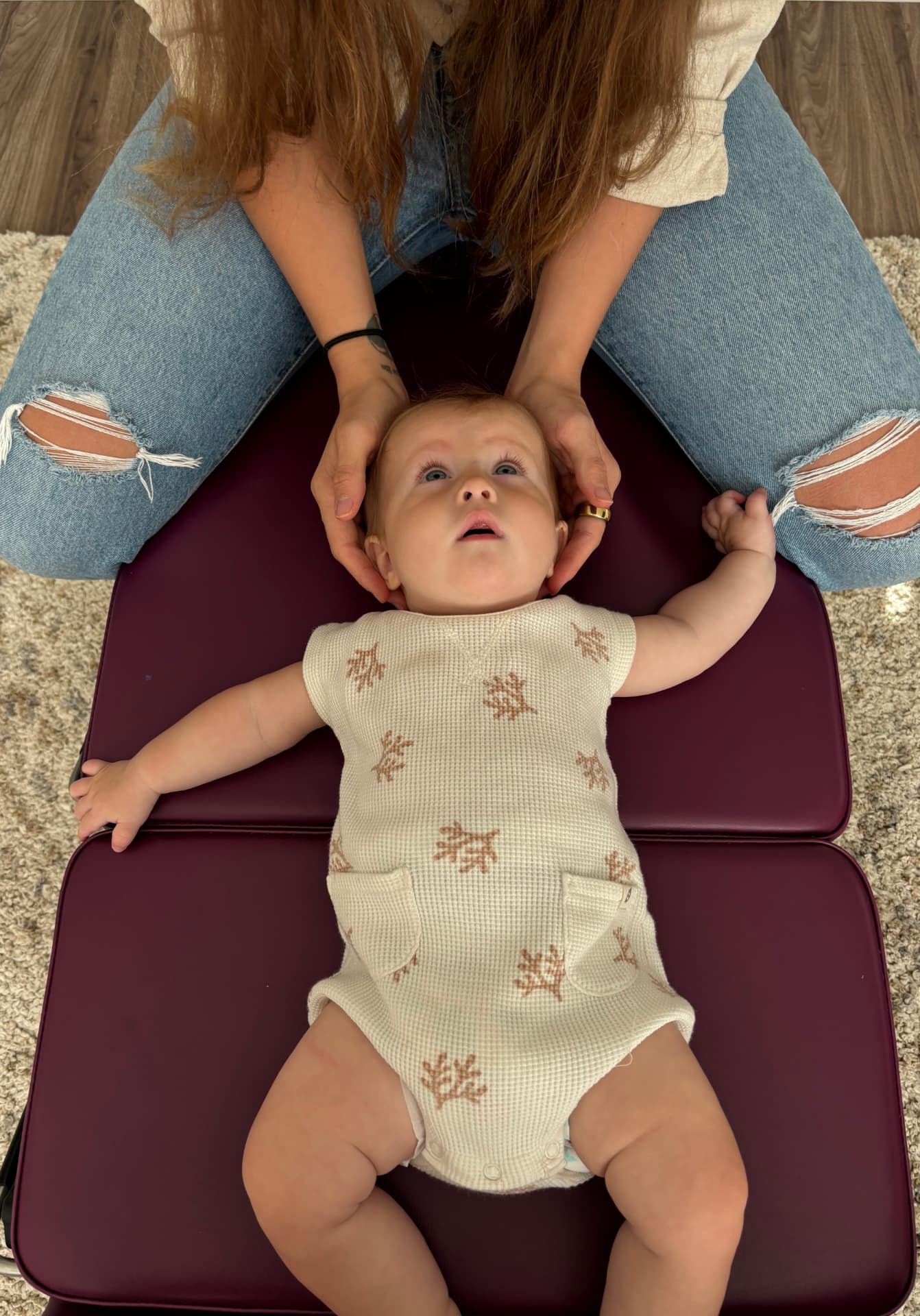 Dr. Shannon providing a gentle fingertip adjustment for a baby